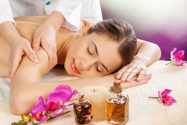 Aromatherapy massage with calming essential oils for relaxation at Bella Spa